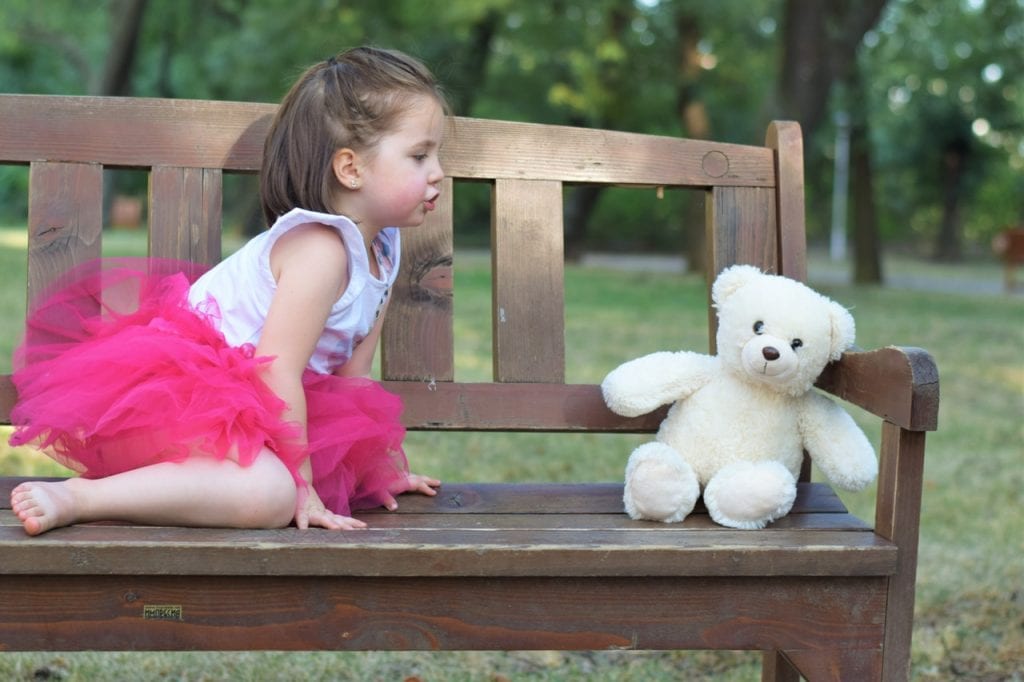 Girl and teddy bear