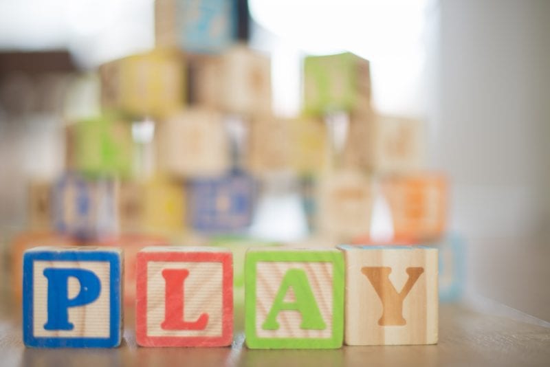 Wooden blocks with letters spelling play